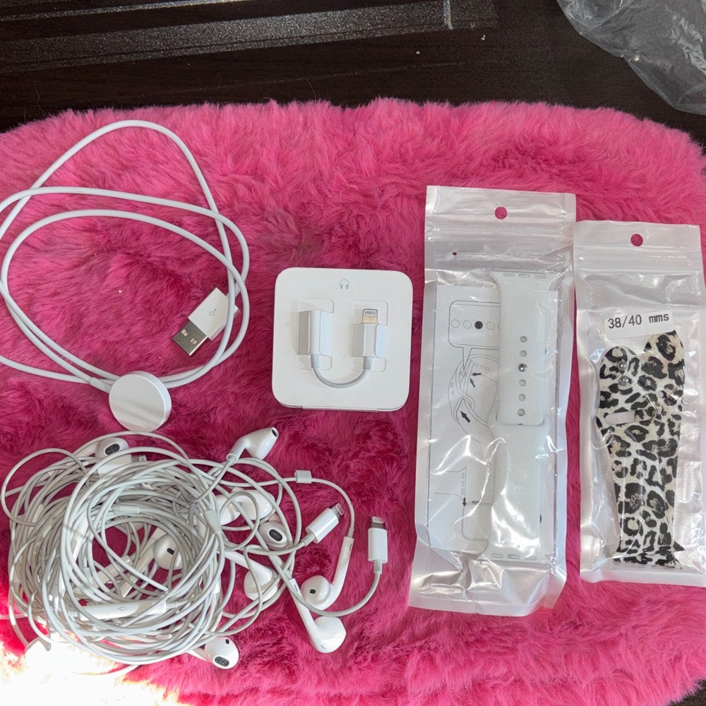 APPLE BUNDLE. includes two watch bands, one headphone adapter, seven p